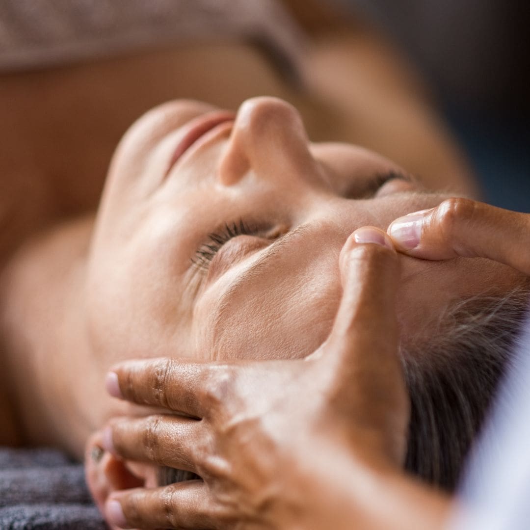 Client receiving a customized facial at a Bolton facial spa